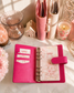 Classic A6 budgeting binder available in pink and ivory, designed for cash envelopes, savings challenges, and inserts.