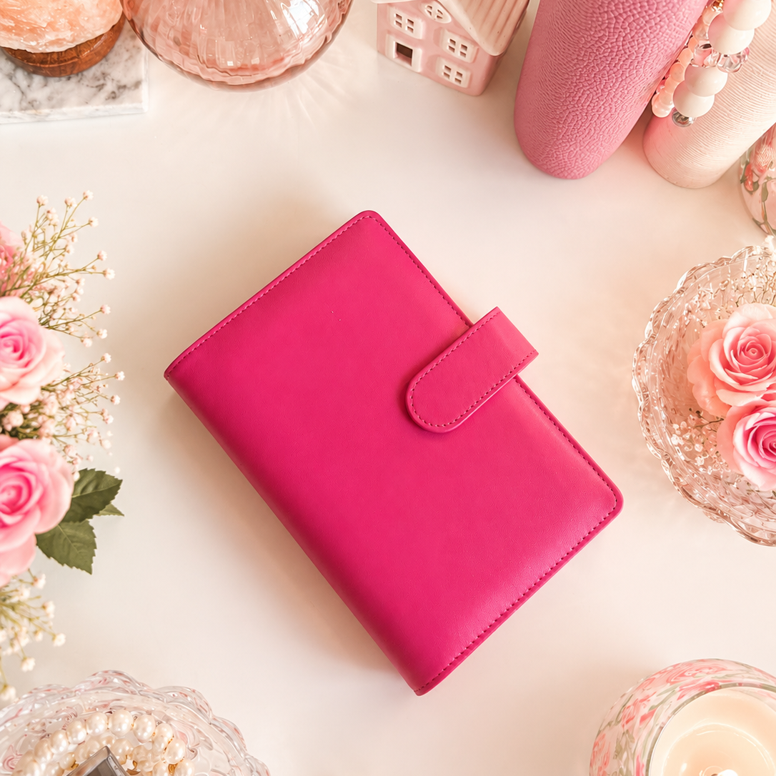 Classic A6 budgeting binder available in pink and ivory, designed for cash envelopes, savings challenges, and inserts.