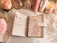 Classic A6 budgeting binder available in pink and ivory, designed for cash envelopes, savings challenges, and inserts.
