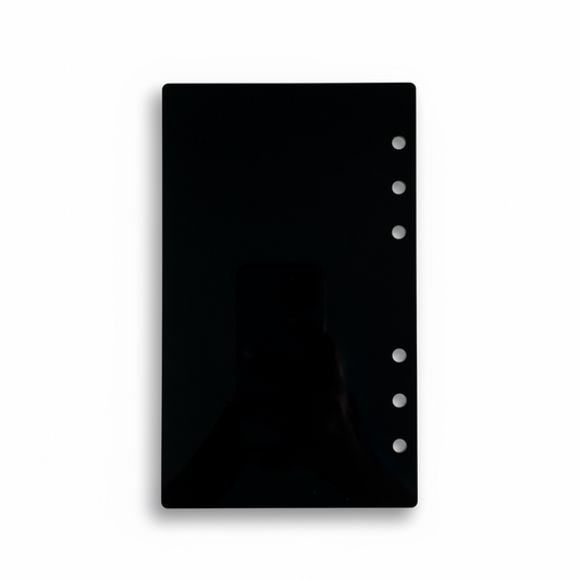Black planner cover with ring binding on a white background